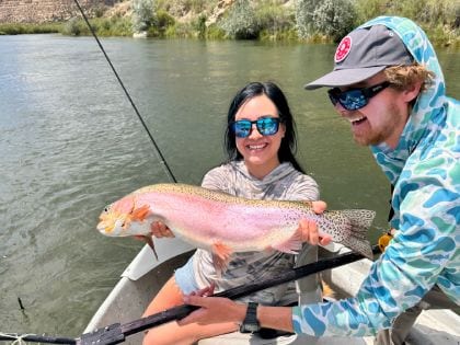 Young girl with large rainbow trout 420