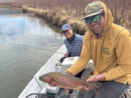 Guide and client with trout